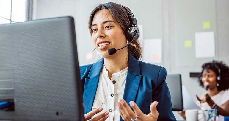 An image of a customer service representative at a utility company helping a utility customer with an issue over the phone
