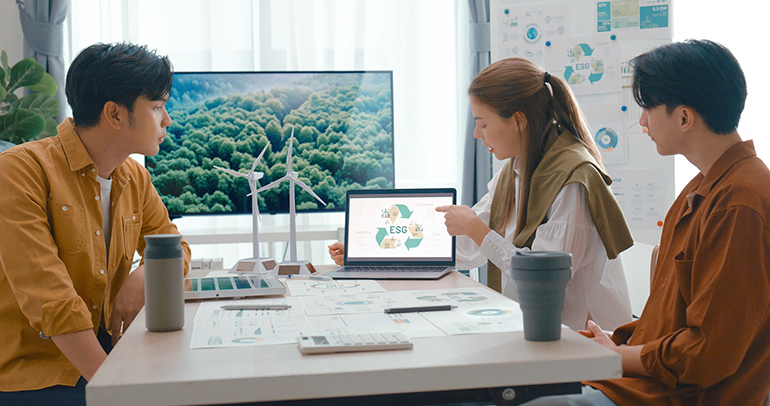 An image of a team discussing how they can better engage with customers on their environmental sustainability efforts and programs