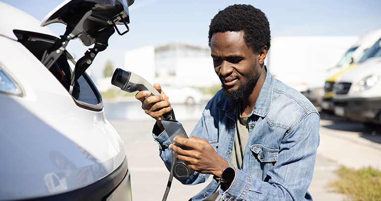 Image of a battery electric vehicle (BEV) owner seeking guidance on how to charge his BEV.