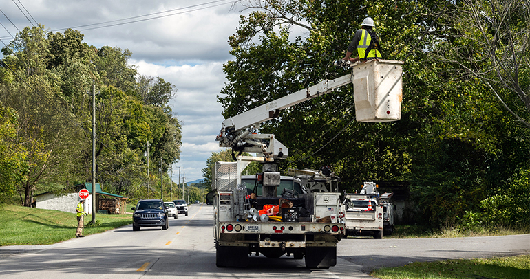 Line worker crew working on the utility lines in a neighborhood