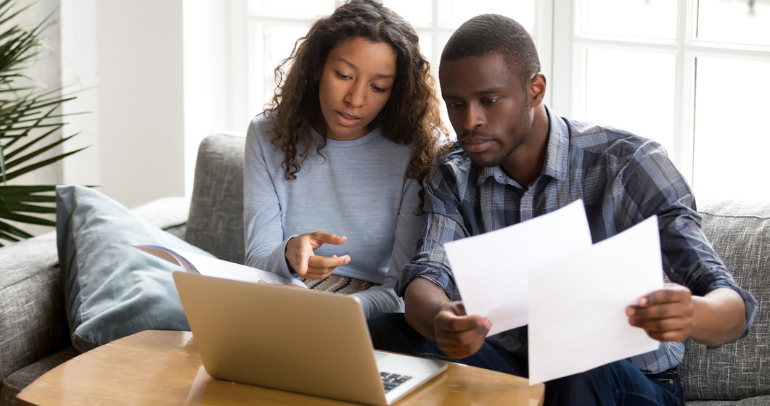 Image of a couple going over their energy bill.